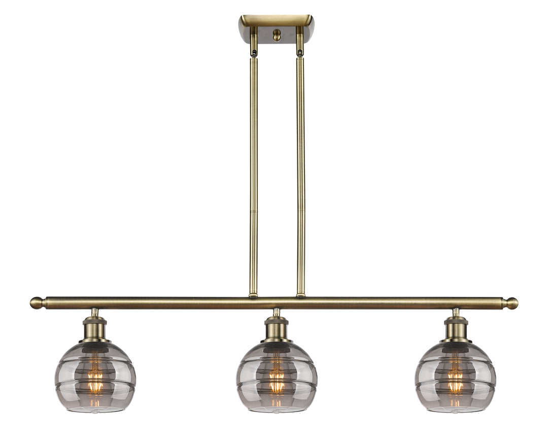 Innovations Lighting Rochester 6" Island Light - Antique Brass Linear Chandeliers Innovations Lighting Light Smoke ; Glass Type: Smoked  