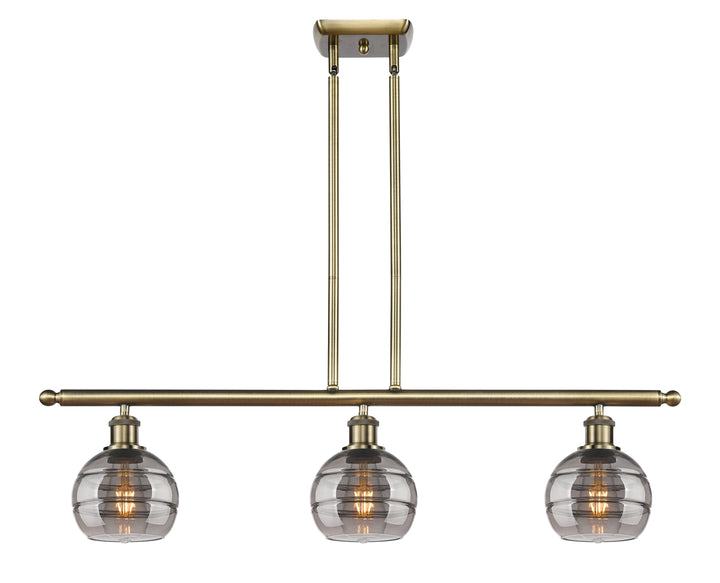 Innovations Lighting Rochester 6" Island Light - Antique Brass Linear Chandeliers Innovations Lighting Light Smoke ; Glass Type: Smoked  